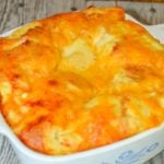 The recipe for this Cheesy Egg Casserole is simple and can use up extra bread you might have in your kitchen.