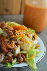 This Taco Salad with Homemade Dressing is perfect for your next pitch-in or as a fun weeknight dinner for the family.