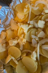 Campfire Potatoes are an easy foil packet potato recipe using aluminum foil.  Aluminum foil potatoes can be made on the grill, campfire or the oven. Since they are cooked in a foil packet, clean up is a snap.
