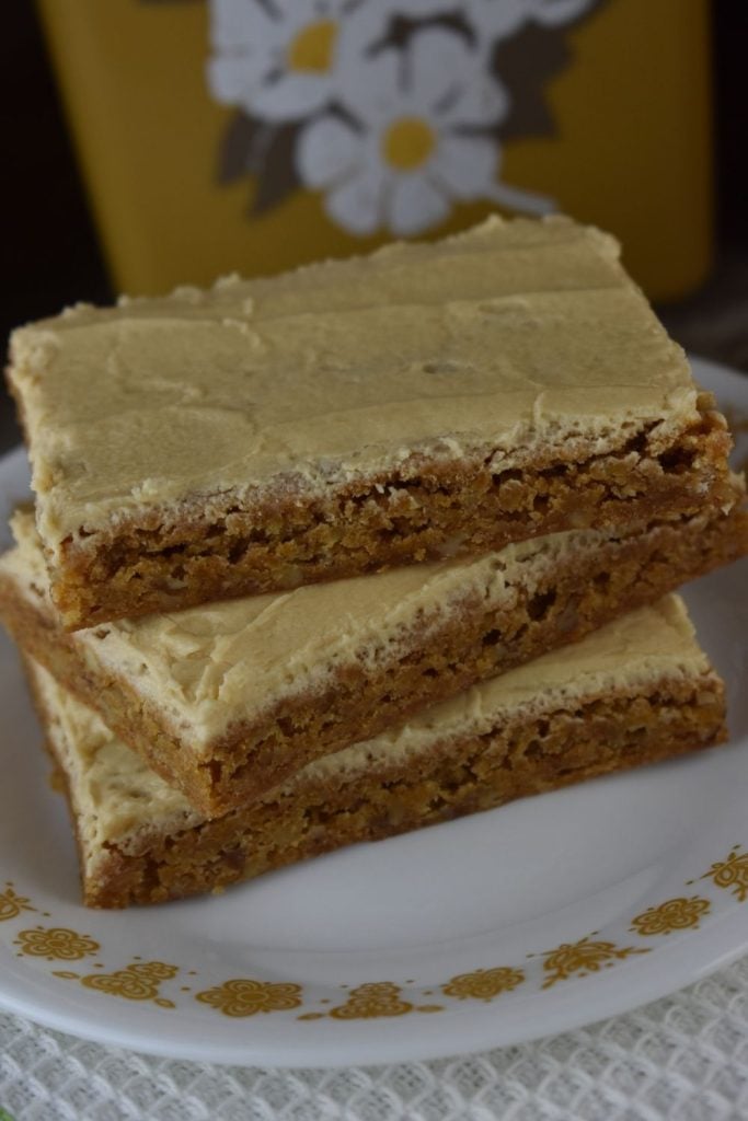 These caramel bars with caramel frosting are made using cake mix and are the perfect bar cookie to make for a quick dessert for the family or a pitch-in at work.