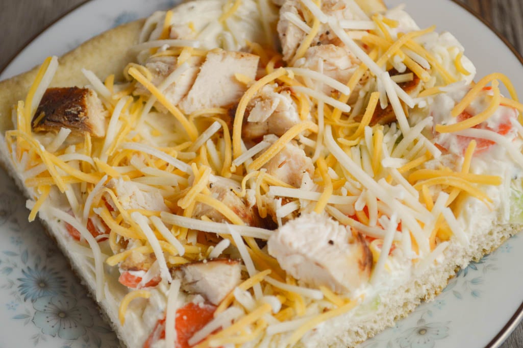 Adding grilled chicken turns the classic cream cheese vegetable bars with a crescent roll crust into this delicious Chicken Ranch Vegetable Pizza.