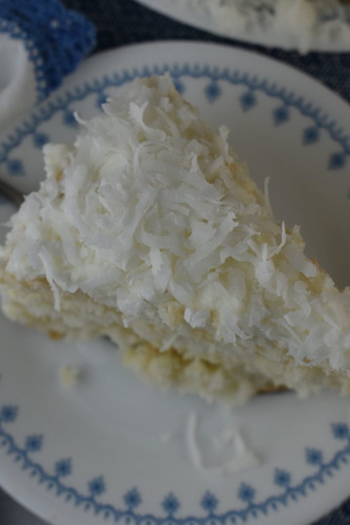 Three Day Coconut Cake with sour cream uses a boxed cake mix and just three other ingredients to make a delicious dessert for the coconut lovers in your life.  Using fresh frozen coconut, this 3 day coconut cake is special.