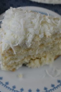 Three Day Coconut Cake with sour cream uses a boxed cake mix and just three other ingredients to make a delicious dessert for the coconut lovers in your life.  Using fresh frozen coconut, this 3 day coconut cake is special.