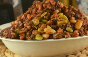 These Crock Pot Calico Beans are easy to make and full of flavor. With bacon, ground beef and four kinds of beans, it is a hearty side dish.