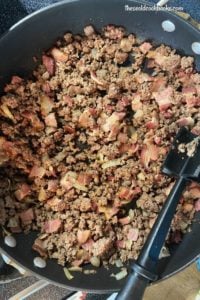 These Crock Pot Calico Beans are easy to make and full of flavor. With bacon, ground beef and four kinds of beans, it is a hearty side dish.