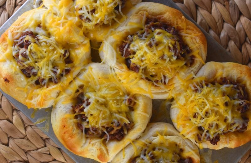 Sloppy Joe Cups have all the flavor of the classic sandwich in an easier to eat package - a biscuit - and topped with yummy cheese. This recipe for sloppy joe cups with flaky biscuits is an all-time kid favorite.