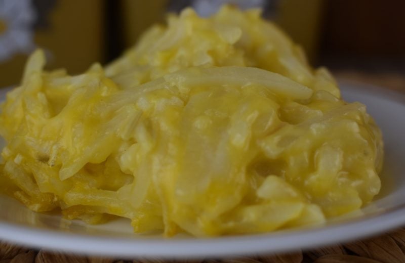 Throw together these 4 Ingredient Crock Pot Cheesy Potatoes in your slow cooker and you'll have time to grill or put together the perfect dessert.  Crock pot cheesy potatoes with hash browns use frozen hash browns, cheddar cheese soup, cream of celery soup and onion. 