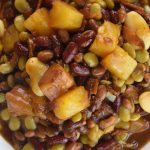 These Crock Pot Baked Beans with Pineapple are a Hawaiian baked bean recipe. The pineapple chunks give each bite a burst of sweetness.