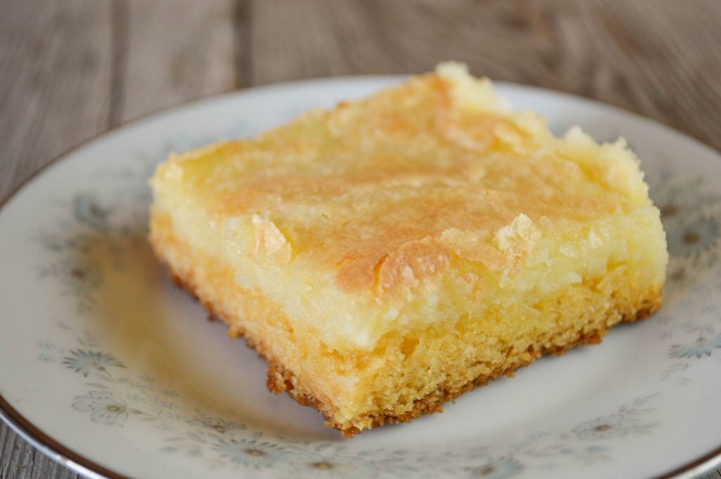These decadent Yellow Cake Mix Gooey Bars are knock your socks off good and super easy to make with just six ingredients.