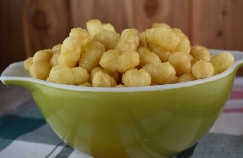 Caramel Puff Corn takes an ordinary snack food and turns into a sweet treat that you won't be able to stop yourself from eating! Seriously, this treat is addicting.  And, it's cheap to make!