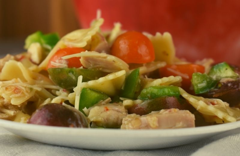 Served warm or cold, this Chicken Bow-Tie Pasta Salad is easy to double or triple for a crowd. With fresh vegetables and chunks of chicken, it is perfect to make ahead and enjoy all week long.