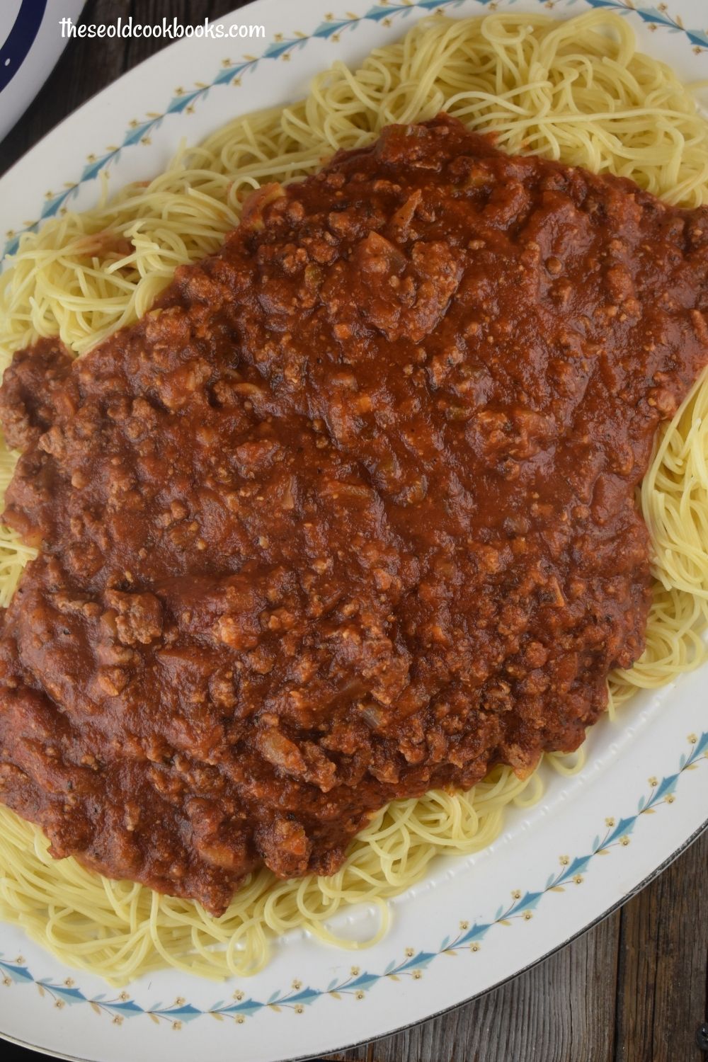 This Slow Cooker Spaghetti Sauce is full of flavor and hearty, featuring ground beef and sausage. Just throw the ingredients in the crock pot and enjoy.