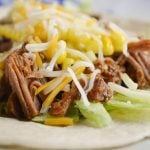 Taking a whole beef roast and turning it into a family-friendly dinner in no time is what this Electric Pressure Cooker Taco Beef recipe is all about.