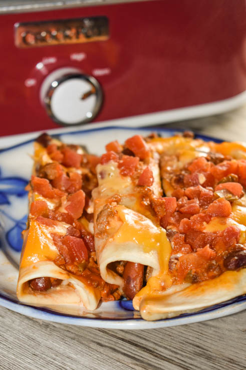 These Crock Pot Ground Beef Acapulco Enchiladas are quick to put together in a casserole crock pot and satisfy the family's need for Mexican food.