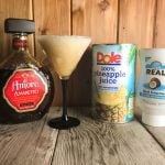 Break out the blender and make this Amaretto Pina Colada for a taste of the beach any time of the year. The blended goodness of pineapple juice, cream of coconut and rum topped with a shot a Amaretto just shouts sunshine and fun.