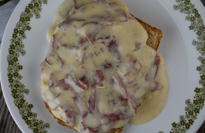 Easy Chipped Beef Gravy is an old-fashioned recipe that goes by many different names, including S.O.S. The dish uses dried beef and is usually served over toast. This old-fashioned dish is fast and kid-friendly dinner option.
