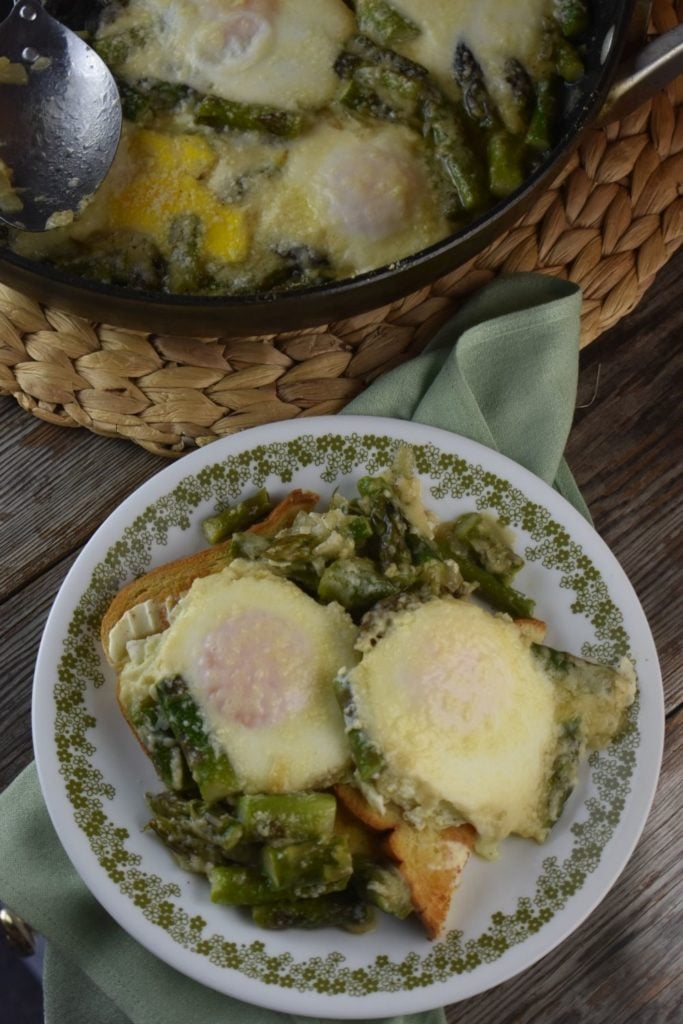 This asparagus egg casserole is the perfect recipe for breakfast, lunch or brunch. You can eat the eggs and asparagus alone, or I like to serve it over buttered toast points (toast cut in a diagonal shape). 