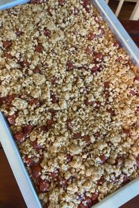 Glazed Oatmeal Cherry Bars recipe is easy to make for a perfect dessert choice. Using cherry pie filling, these dessert bars feature a buttery brown sugar and oatmeal crust and topping.  Cherry Bars with cherry pie filling are great to feed a crowd.