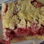 Grandma's Rhubarb Streusel Dessert features fresh rhubarb and a sweet crumbly topping. Using simple ingredients, rhubarb bars with shortbread crust will have the rhubarb-lovers in your life asking for seconds.