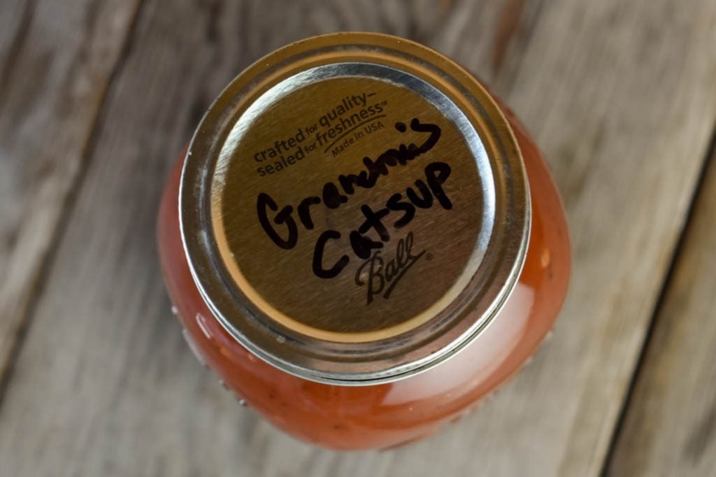 Store Grandma's Homemade Ketchup (Catsup) in a Mason Jar and write on the lid what it is and the date you made it.