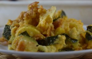 Cheesy Summer Squash and Zucchini Casserole is a great use of all of the summer garden bounty. This easy cheesy squash casserole has a buttery, crunchy top and a cheesy filling. Y