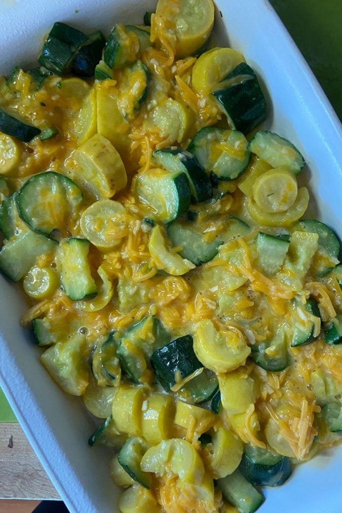 Cheesy Summer Squash and Zucchini Casserole is a great use of all of the summer garden bounty. This easy cheesy squash casserole has a buttery, crunchy top and a cheesy filling. Y