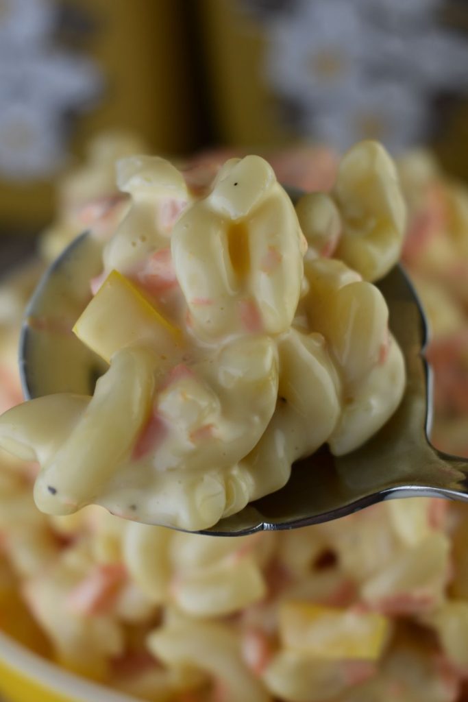 Classic Macaroni Salad with sweetened condensed milk is the perfect side dish for any meal. Just one bite takes you back in time.