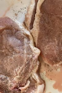 Fancy Baked Pork Chops are an oven baked pork chop recipe with an easy sauce of only 4 ingredients. Serve over rice or mashed potatoes for an instant dinner. 