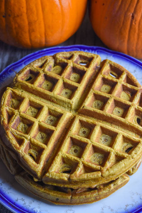 These fluffy Pumpkin Waffles with a hint of cinnamon are the perfect fall breakfast treat.  You can make this simple waffle batter featuring pumpkin ahead of time and store in the refrigerator overnight.