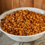 Using three ingredients - butter peanuts and chili seasoning, these Crock Pot Chili Nuts are a snack you won't be able to stop eating.