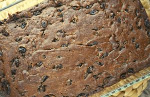 Old-Fashioned Boiled Raisin Cake with Brown Sugar Frosting is a spice cake featuring raisins cooked in brown sugar. This vintage cake is flavored with a combination of cocoa, cinnamon nutmeg, ground cloves and allspice.