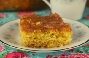 This Honey Bun Coffee Cake recipe takes a box of yellow cake mix and adds a couple extra ingredients to turn it into a delicious breakfast or dessert treat.