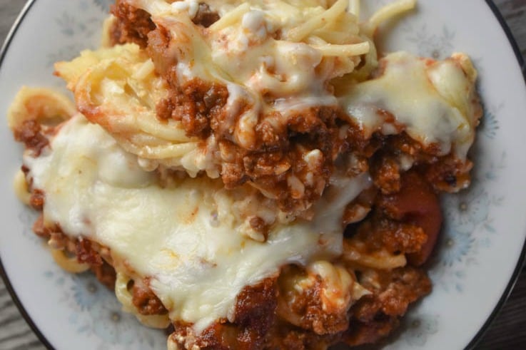 This family-pleasing Spaghetti Pie recipe features ground beef and staple pantries such as stewed tomatoes, tomato paste and spaghetti for the ultimate dinner.