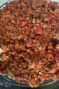 This family-pleasing Spaghetti Pie recipe features ground beef and staple pantries such as stewed tomatoes, tomato paste and spaghetti for the ultimate dinner. Interested in doing some freezer meals? Assemble this spaghetti pie, cover with foil and put in the freezer for easy weeknight meal prep.