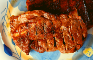 Grilled pork shoulder steaks will be a new go-to recipe for your summer grilling rotation. Simply let the steak marinate in a dry rub of garlic salt, paprika, brown sugar, and black pepper for 15 minutes, and grill. The result is a tender, pork steak full of flavor that the whole family will enjoy.