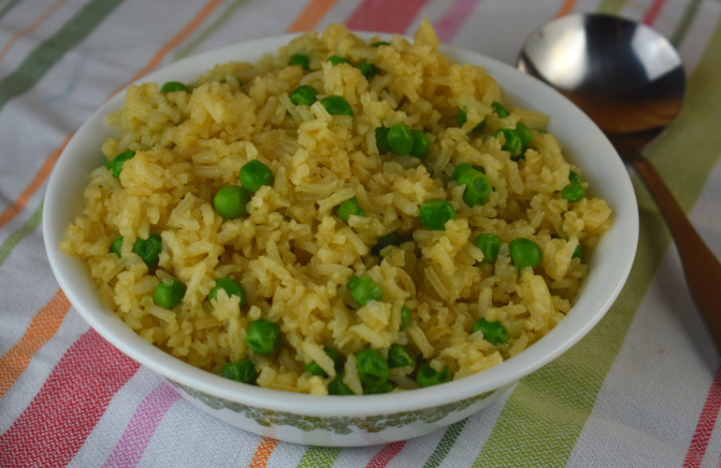 Easy Rice Pilaf with Peas is an easy side dish to complement your regular dinner menu.  The recipe consists of five simple ingredients--white rice, broth, butter, onions and peas.  This is an easy way to add some vegetable to your kids diet without complaints.