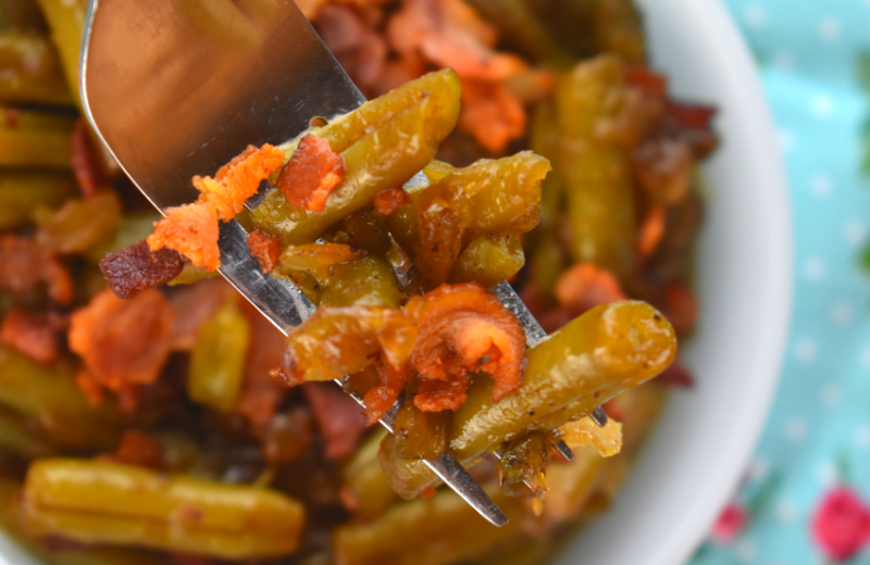 Sweet and Sour Green Beans with bacon is a fast way to jazz up a regular can of green beans.  Bacon, onions, sugar and vinegar turns a bland can of beans into a family-pleasing side dish in no time flat. 