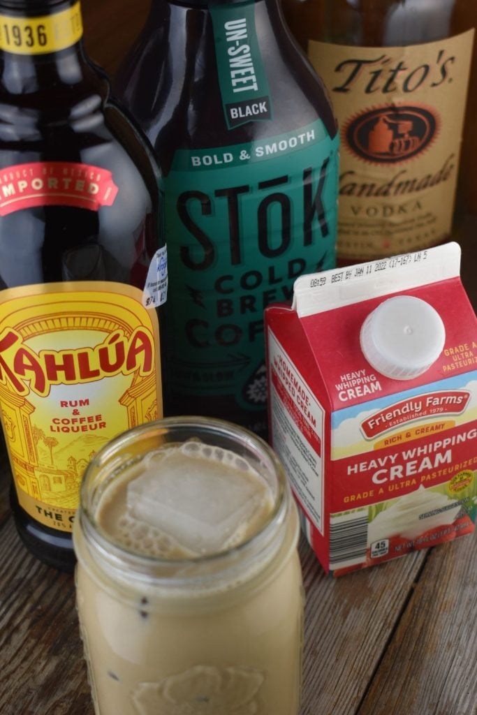 The ingredients for a dirty white Russian cocktail are really simple. Cold brew coffee, heavy whipping cream, vodka and Kahlua.