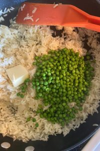 Easy Rice Pilaf with Peas is an simple side dish to complement your favorite dinner entrees. The recipe consists of five simple ingredients - white rice, broth, butter, onions and peas.  Rice Pilaf with Vegetables recipe is an easy way to add some vegetables to your kids' diet without complaints.