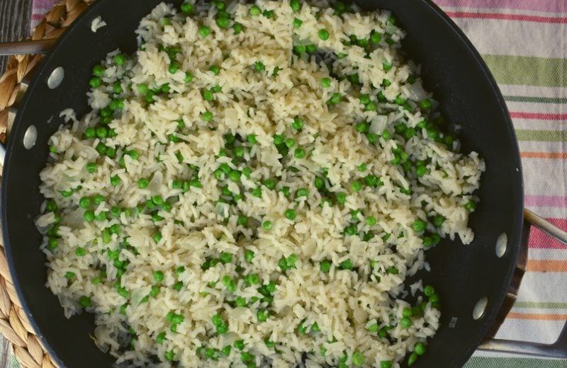 Easy Rice Pilaf with Peas is an simple side dish to complement your favorite dinner entrees. The recipe consists of five simple ingredients - white rice, broth, butter, onions and peas.  Rice Pilaf with Vegetables recipe is an easy way to add some vegetables to your kids' diet without complaints.