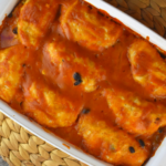 Easy Chicken Enchilada Biscuit Bake is the perfect dinner for a busy weeknight. Chicken, black beans and cheese are stuffed into canned, refrigerated biscuits and then baked in a combination of enchilada sauce and cream of chicken soup. The result will have your family licking their plates and begging for more.