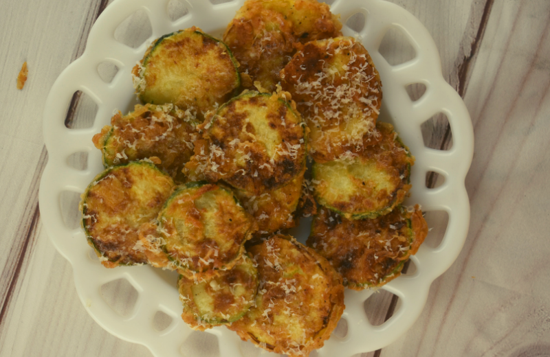 Easy Pan Fried Zucchini is a fast side dish to use up garden zucchini.  These zucchini coins are breaded lightly and pan fried until crispy, salty and delicious. Grate with fresh Parmesan, and serve!