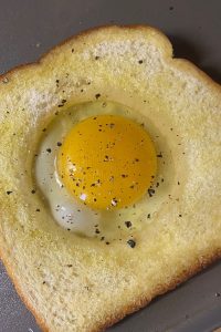 Egg in a Basket is a simple, yet delicious breakfast dish that you can have on the table in less than 10 minutes. A variation of the classic British dish - toad in the hole - this recipe features just toast and a runny fried egg.