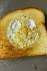 Egg in a Basket is a simple, yet delicious breakfast dish that you can have on the table in less than 10 minutes. A variation of the classic British dish - toad in the hole - this recipe features just toast and a runny fried egg.