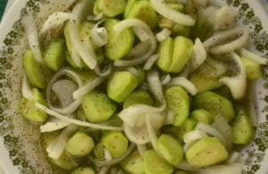 Mom's Cucumbers and Onions is an old fashioned recipe featuring garden vegetables.  The ingredients are simple - cucumbers, onions, salt, vinegar, sugar, celery seed and black pepper, but the finished result is the perfect accompaniment to any summer meal.