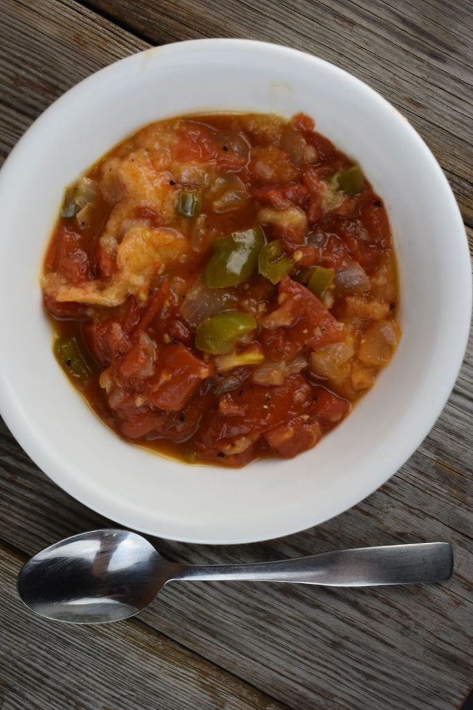 Old Fashioned Stewed Tomatoes are a treat for your taste buds.  Garden tomatoes are cooked slowly with onions, green peppers and butter to form a rich sauce which is soaked up with chunks of bread.  Sweet stewed tomatoes is the perfect accompaniment for any summer meal.