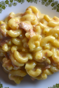Tuna Macaroni and Cheese is a quick, stove top dinner that can be made from pantry staples.  The extra cheesy tuna mac goodness will satisfy everyone in your house.