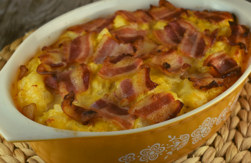 Cheesy Potatoes with Bacon will be your new favorite side dish. It features an easy cheese sauce made with Velveeta, Miracle Whip, salt and black pepper and a bacon topping that sends the humble potato out of this world. 