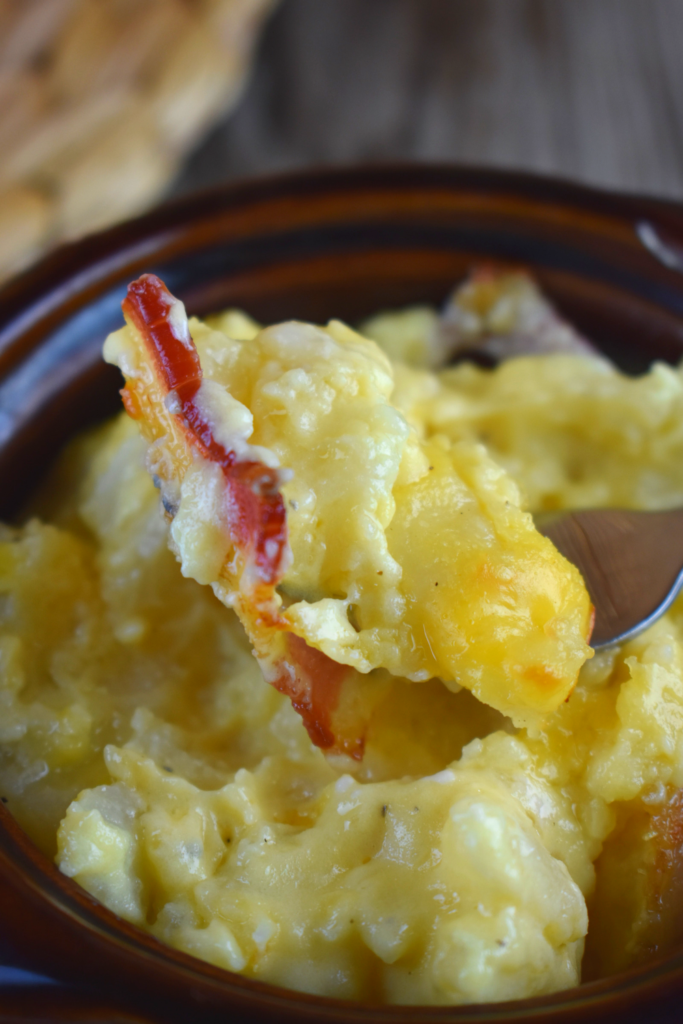 Every bite of cheesy potatoes with bacon is full of cheesy goodness.