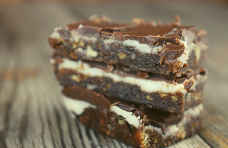 Grandma's Three Layer Chocolate Squares are a family favorite treat that are served every Christmas at my house.  The triple layer cookie bar consists of a chocolate graham cracker crust, a vanilla cream center and a sweet Hershey's chocolate topping.  The combination is a match made in chocolate heaven. 